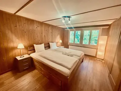 Ein Bett oder Betten in einem Zimmer der Unterkunft Scenic Stay Grindelwald Interlaken & Lauterbrunen