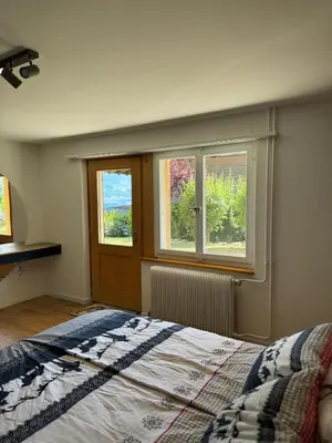 Ein Bett oder Betten in einem Zimmer der Unterkunft Chalet Zytrösli