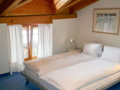 Ein Bett oder Betten in einem Zimmer der Unterkunft Apartment Chalet Abendrot apARTments-31 by Interhome