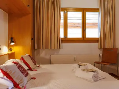 Ein Bett oder Betten in einem Zimmer der Unterkunft Apartment Hortensia 33 by Interhome