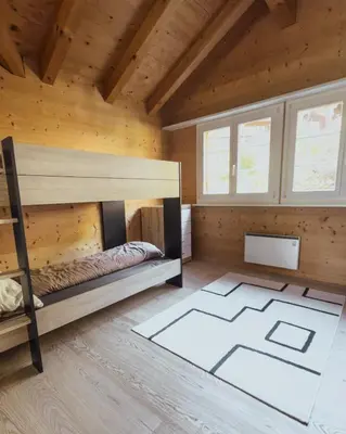 Ein Bett oder Betten in einem Zimmer der Unterkunft Grosszügige Wohnung Leiterli