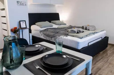 Ein Bett oder Betten in einem Zimmer der Unterkunft Modernes Studio I Majing I Leukerbad I Gemmi