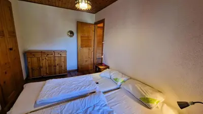 Ein Bett oder Betten in einem Zimmer der Unterkunft Residence Evolene 31 Appartement 2 personnes