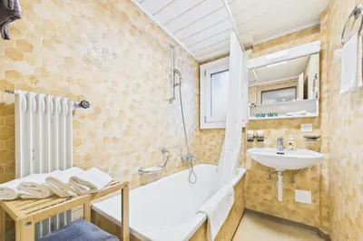 Ein Badezimmer in der Unterkunft Vacation rental in Saas-Grund ideal for families