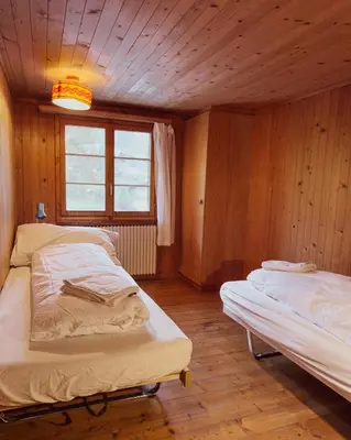 Ein Bett oder Betten in einem Zimmer der Unterkunft Chalet Brauerei