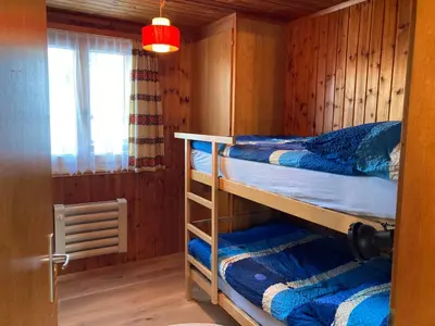 Ein Bett oder Betten in einem Zimmer der Unterkunft Chalet Lueg uf Belalp