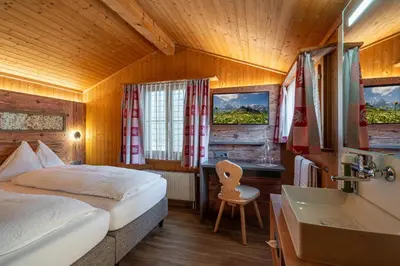 Ein Bett oder Betten in einem Zimmer der Unterkunft Chalet Stöckli
