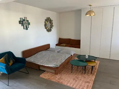 Ein Sitzbereich in der Unterkunft Suite moderne avec jacuzzi