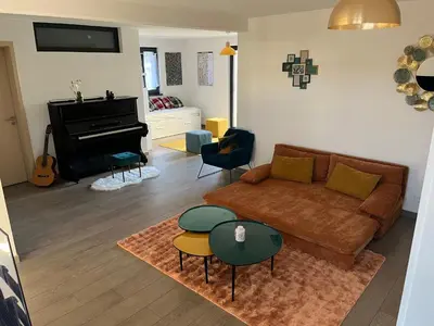 Ein Sitzbereich in der Unterkunft Suite moderne avec jacuzzi