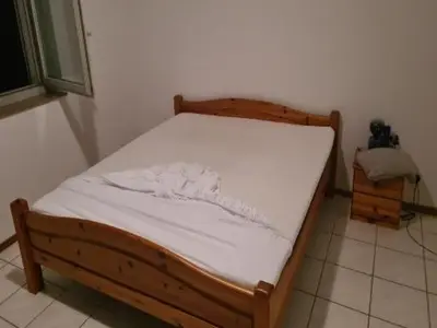Ein Bett oder Betten in einem Zimmer der Unterkunft Grotto osteria di Baloi