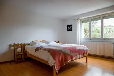 Ein Bett oder Betten in einem Zimmer der Unterkunft Le Cerisier
