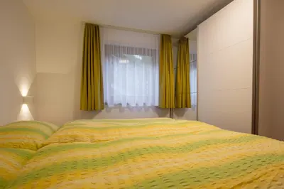 Ein Bett oder Betten in einem Zimmer der Unterkunft Haus Amici
