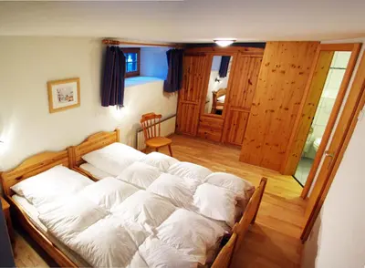 Ein Bett oder Betten in einem Zimmer der Unterkunft Chalet Heimeli