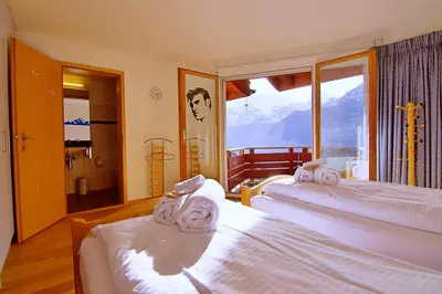 Ein Bett oder Betten in einem Zimmer der Unterkunft Eiger Residence 3