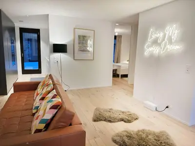 Ein Sitzbereich in der Unterkunft Modern Apartment with Balcony and BBQ at Interlaken West Station
