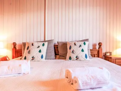 Ein Bett oder Betten in einem Zimmer der Unterkunft Apartment Les Agettes 1865 by Interhome