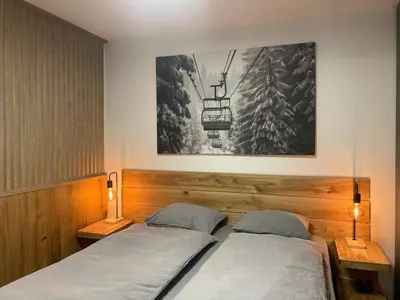 Ein Bett oder Betten in einem Zimmer der Unterkunft Best view of Leukerbad - All new - free Parking