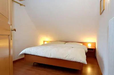 Ein Bett oder Betten in einem Zimmer der Unterkunft Residence Jungfrau