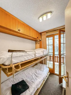 Ein Bett oder Betten in einem Zimmer der Unterkunft Lift Bear Lodge - 4Valleys - Swiss Alps