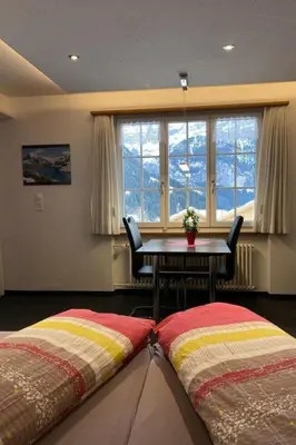 Ein Bett oder Betten in einem Zimmer der Unterkunft Apartment Chalet Mislin- Grindelwald direkte Bergsicht by Interhome