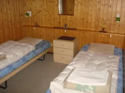 Ein Bett oder Betten in einem Zimmer der Unterkunft Apartment Chalet Bärli by Interhome
