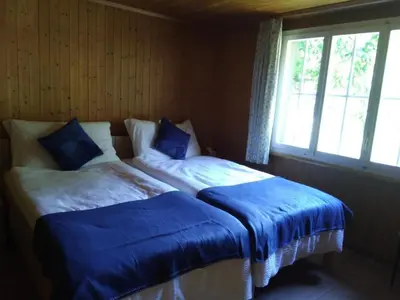 Ein Bett oder Betten in einem Zimmer der Unterkunft Holiday Home Ferien Cottage Flüehblüemli by Interhome
