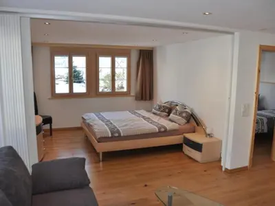 Ein Bett oder Betten in einem Zimmer der Unterkunft Apartment im Chalet Adelheid by Interhome