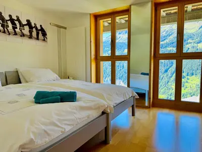 Ein Bett oder Betten in einem Zimmer der Unterkunft Schweizerheim Residence 1