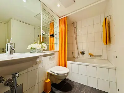 Ein Badezimmer in der Unterkunft Schweizerheim Residence 1
