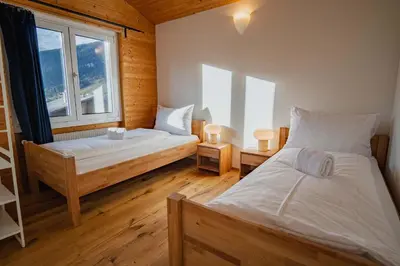 Ein Bett oder Betten in einem Zimmer der Unterkunft Chalet Flora Mountain view with Private Garden
