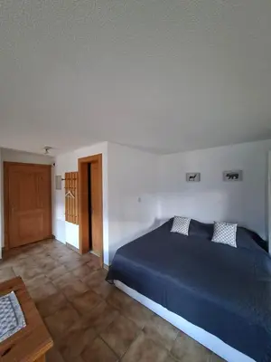 Ein Bett oder Betten in einem Zimmer der Unterkunft Studio Chalet Edelweiss