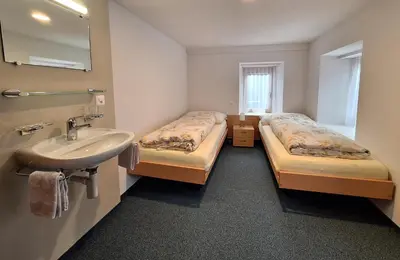 Ein Bett oder Betten in einem Zimmer der Unterkunft Sonnenhügel