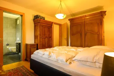 Ein Bett oder Betten in einem Zimmer der Unterkunft Résidence Lisaride à Evolène - appartement spacieux et lumineux avec vue