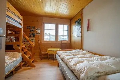 Ein Bett oder Betten in einem Zimmer der Unterkunft Kleewasu Apartment