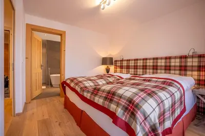 Ein Bett oder Betten in einem Zimmer der Unterkunft Royal A 40012