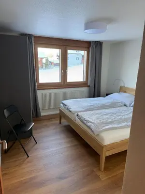 Ein Bett oder Betten in einem Zimmer der Unterkunft Alpine Lodge Münster VS moderne Eigentumswohnung