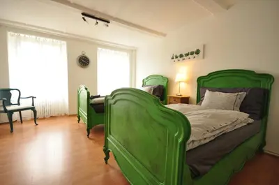 Ein Bett oder Betten in einem Zimmer der Unterkunft Interlaken Town House Sleeps 12 guests Central