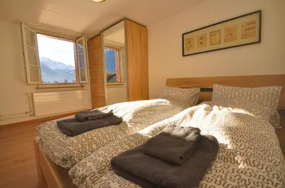 Ein Bett oder Betten in einem Zimmer der Unterkunft Seegärtli Riverside Apartment