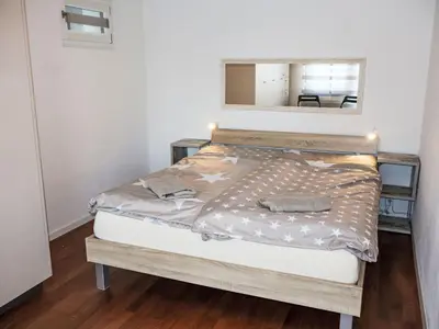 Ein Bett oder Betten in einem Zimmer der Unterkunft Apartment Castello-2 by Interhome