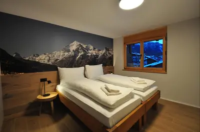 Ein Bett oder Betten in einem Zimmer der Unterkunft Tossu, Haus Metropol B