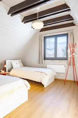 Ein Bett oder Betten in einem Zimmer der Unterkunft Boutique Ferienhaus mit Sauna - TheHerbertRealp