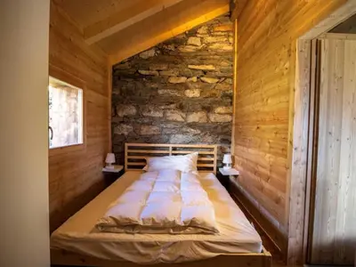 Ein Bett oder Betten in einem Zimmer der Unterkunft Holiday Home Alp 2100 - Mayen exklusiv by Interhome