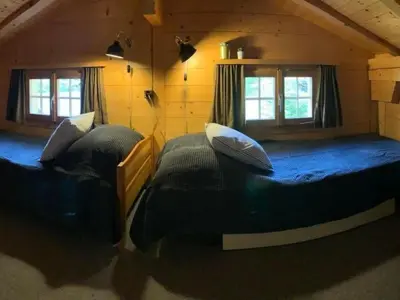 Ein Bett oder Betten in einem Zimmer der Unterkunft Holiday Home Chalet Bärgblüemli by Interhome