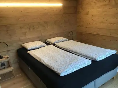 Ein Bett oder Betten in einem Zimmer der Unterkunft Holiday Home Willenschwand Adelboden by Interhome