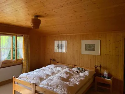 Ein Bett oder Betten in einem Zimmer der Unterkunft Holiday Home Chalet Finkenwiese - für 8 Erwachsene und 5 Kinder by Interhome