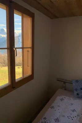 Ein Bett oder Betten in einem Zimmer der Unterkunft Holiday Home Chalet Felsli by Interhome