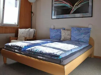Ein Bett oder Betten in einem Zimmer der Unterkunft Apartment Trollhütte 4-Bett-Wohnung by Interhome