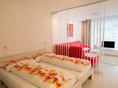 Ein Bett oder Betten in einem Zimmer der Unterkunft Apartment Haus Flaminia by Interhome