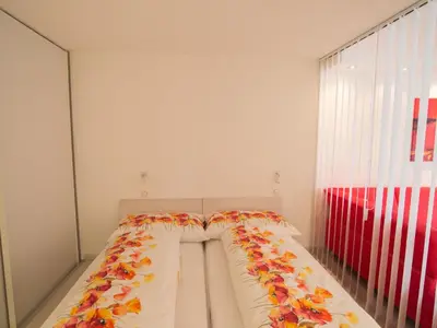 Ein Bett oder Betten in einem Zimmer der Unterkunft Apartment Haus Flaminia by Interhome