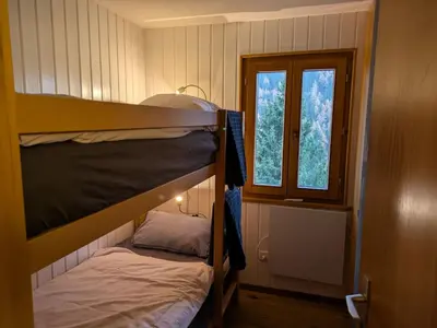 Ein Bett oder Betten in einem Zimmer der Unterkunft Holiday Home Chalet Le Griffon by Interhome